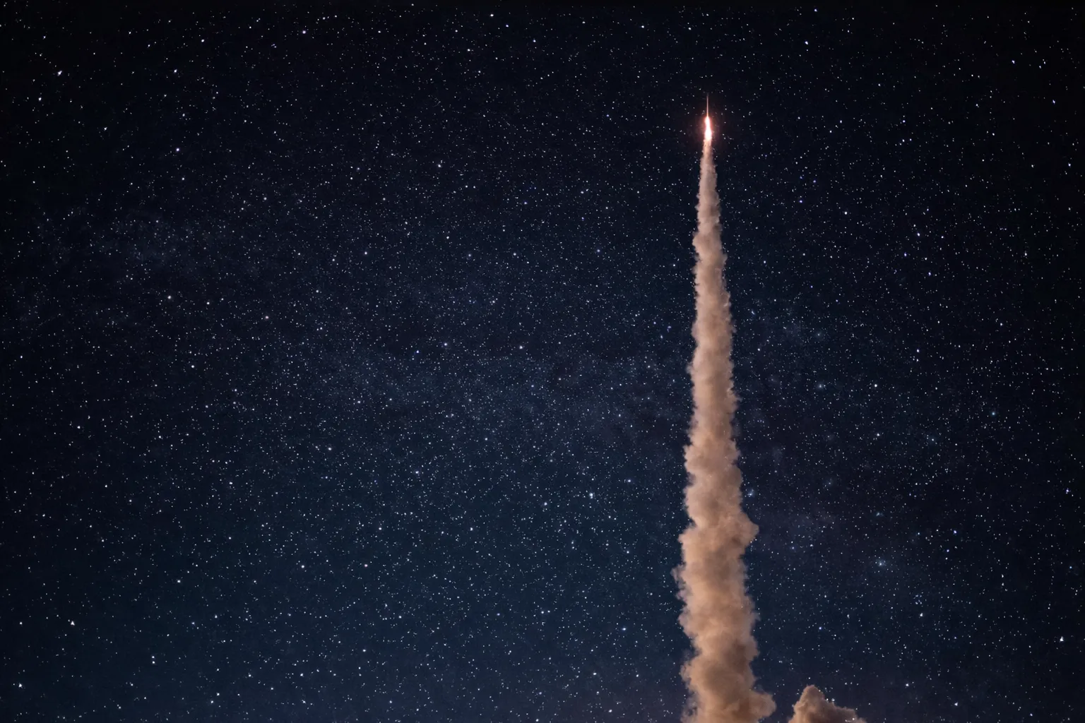 Fusée s'élevant dans le ciel étoilé